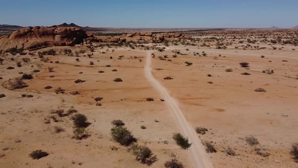 Aerial footage of the amazing desert and big rocks, sand and desert plants