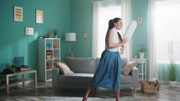 Young Woman Is Performing with Cleaning Brush at Home
