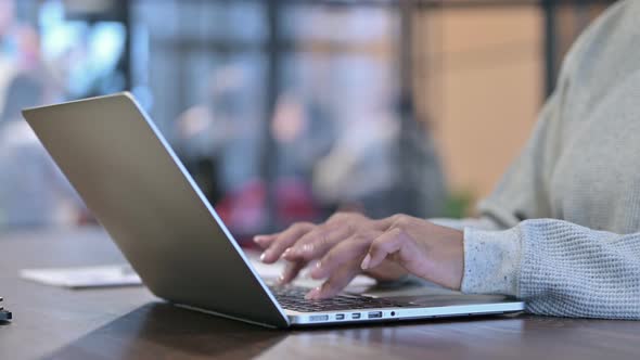 Side View of Female Hands Typing on Laptop