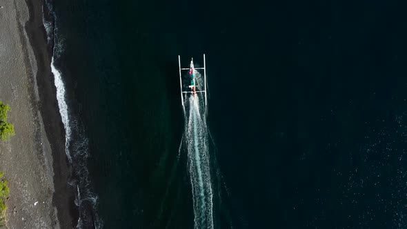 Top down view on sailing boat near to the beach