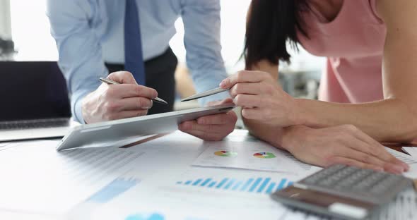 Business Man and Woman Studying Information on Digital Tablet at Table  Movie Slow Motion