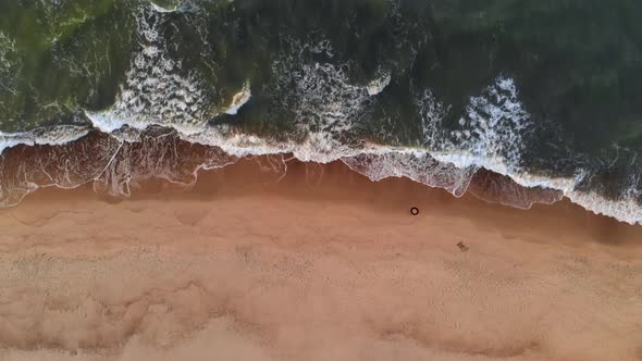 Aerial View A Video of a Tropical Beach at Sunset Showing Evening Aerial Footage of Green Foaming