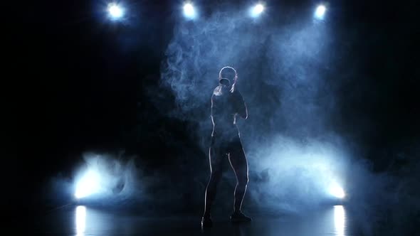 Intense Woman Boxer Throwing Punches. Slow Motion in the Studio