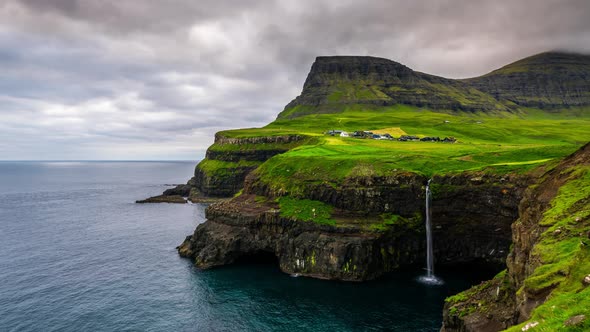 Timelapse of Sunset at Mulafossur Waterfall and Gasadalur Village