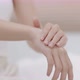 Close up woman hands pushing pump plastic lotion bottle applying moisturizing cream on hands. - VideoHive Item for Sale