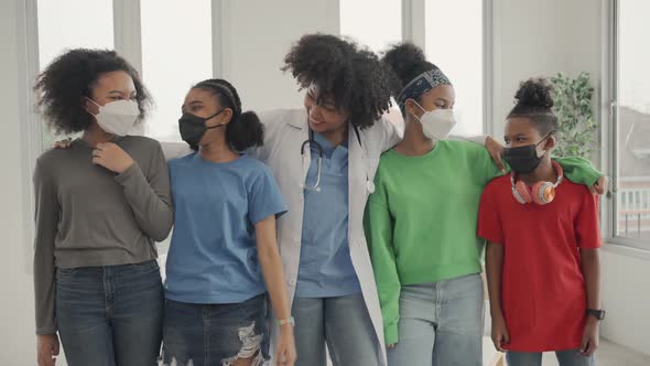 African American doctor and kids making laughing in the hospital or clinic.