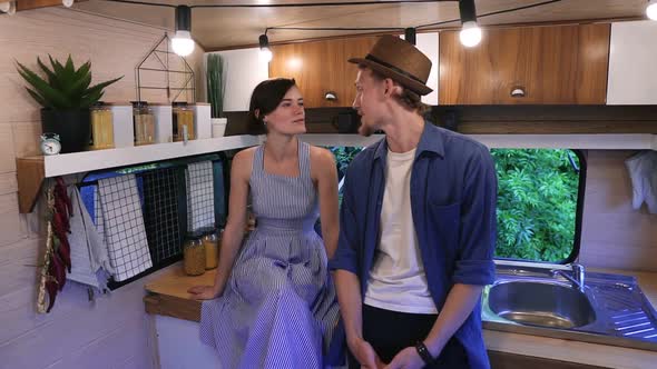 Beautiful Couple Having Time Together in the Stylish Kitchen in Van Laughing Hugging