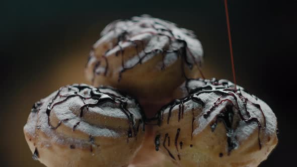 Profiteroles with Custard Cream Pouring with Chocolate Topping