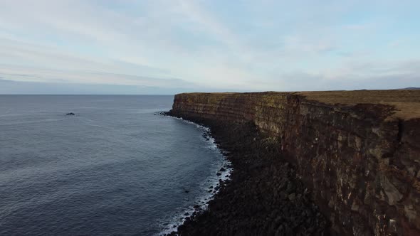 Flying Over Steep Cliffs with Red Seams