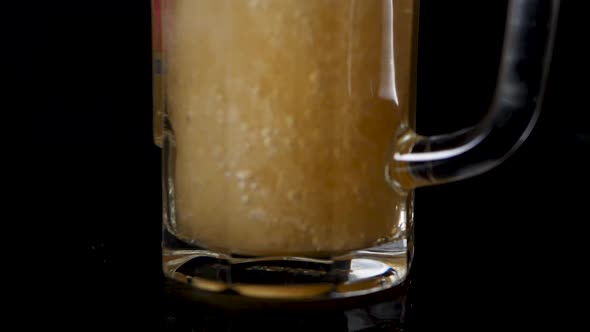 Macro shot of pouring beer in a glas.