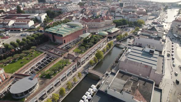 Water channel in Aveiro city center, Portugal. Aerial orbiting shot above downtown