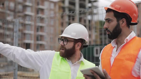 The Builder and Architect Man Are Discussing the Construction Plan of the Modern Business Center