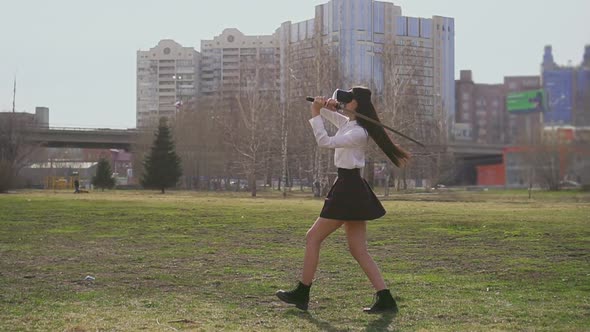 School Girl Use Virtual Reality Headset and Katana.