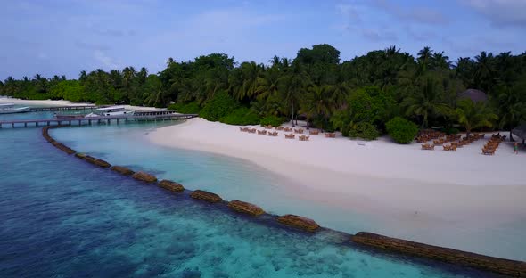 Daytime drone abstract view of a white paradise beach and aqua turquoise water background in 