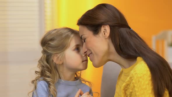 Cheerful Lady and Girl Nuzzling and Laughing, Playing and Having Fun Together