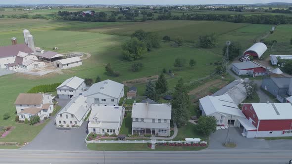 Aerial View of Amish Church Meeting with Horse and Buggies on a Sunny Summer Day