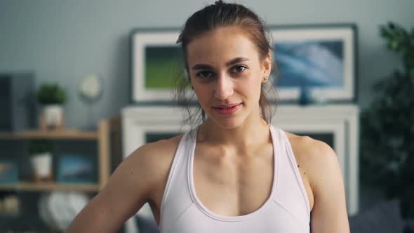 Slow Motion Portrait of Beautiful Sporty Girl Looking at Camera and Smiling