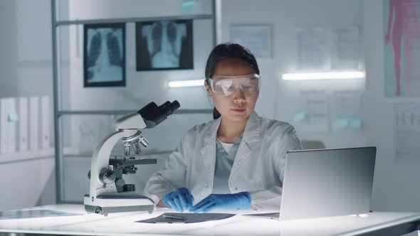 Asian Woman Working In Laboratory