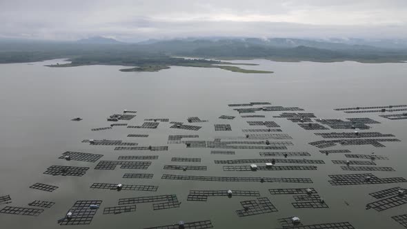 Aerial view of traditional floating fish pond on lake in Indonesia