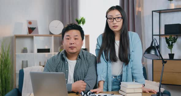 30-Aged Asian Freelancers Posing on Camera with Serious Faces 
