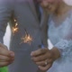 Happy Asian Bride And Groom In Wedding Dress Burning Sparklers Bengal Lights - VideoHive Item for Sale