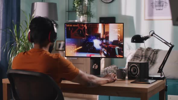 Guy Playing Videogame in Living Room