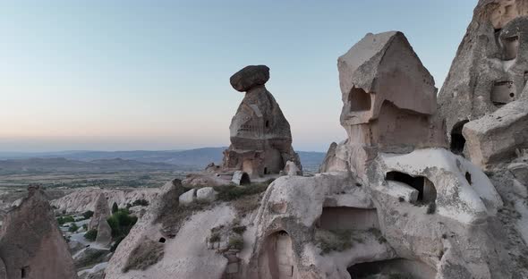 Aerial View of Natural Rock Formations in the Sunset Valley with Cave Houses in Cappadocia Turkey