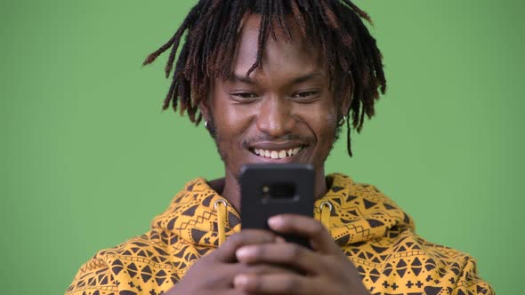 Young Happy African Man Using Phone