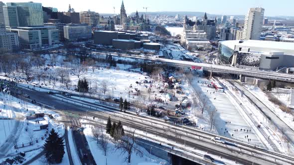 Forward aerial overview of wintertime Ottawa during trucker protests