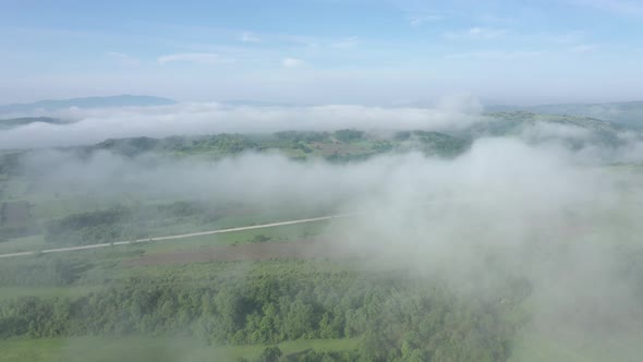 Flying high above fog and clouds 4K drone video