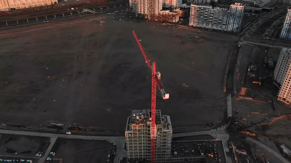 Epic Flight Over the Construction Crane,. on the Construction of a Building, Shooting with the Drone