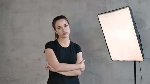 Caucasian Girl with Long Tail Shows Emotion Indifference