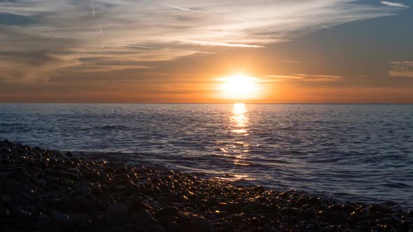 Beautiful Sunset Over the Sea in the Clouds. Time Lapse