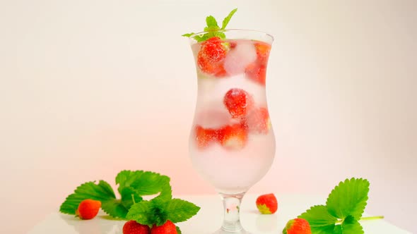 Strawberry water  glass with ice and strawberries