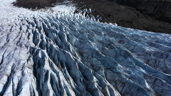 Melting Glacier landscape in Iceland with deep crevasses and patterns. 4K