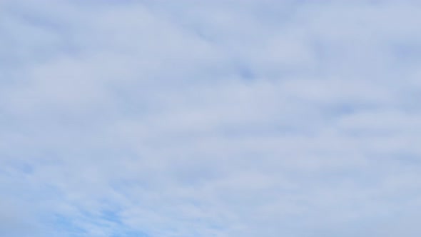 Cirrus clouds on blue sky close-up, timelapse