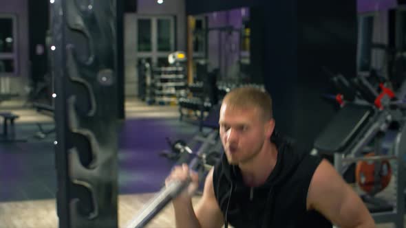 Fitness young strong man in the gym