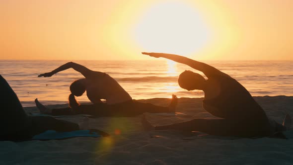 Group Of Women Practicing Yoga