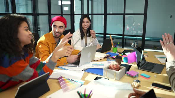 Team Members Cheering on Leader During Meeting