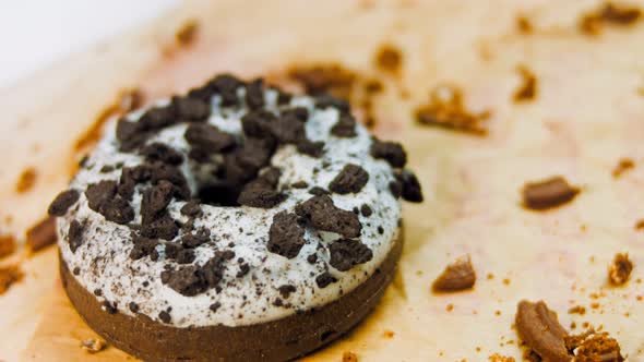 Chocolate Donuts Decorated with Pieces of Oreo Biscuits