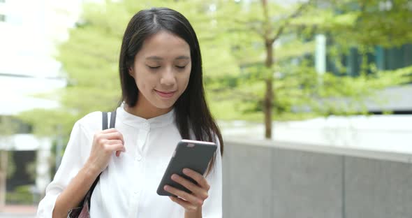 Young Woman use of smart phone in city