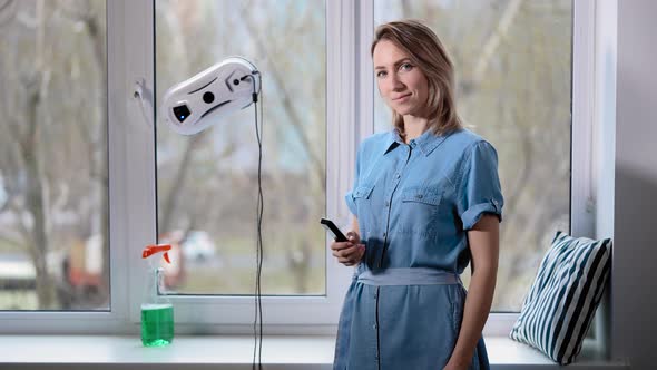 Attractive Woman Housewife in a Blue Dress