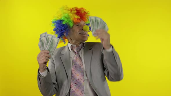 Elderly Clown Businessman Entrepreneur Boss Dancing with Money Cash Banknotes