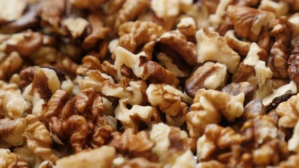 Healthy walnut out its shell food pile  background 4K 2160p 30fps UltraHD  pan footage - Brown piece