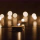 Wide Shot Of Tealight Over Flickering Backdrop - VideoHive Item for Sale