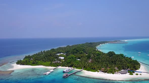 Aerial drone panorama of resort beach by blue ocean and sand background