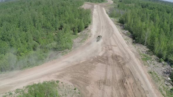 Armoured vehicle on country road, aerial view