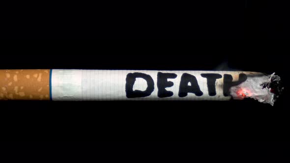 A Cigarette Smolders with the Word "Death". Cigarette on a Black Isolated Background