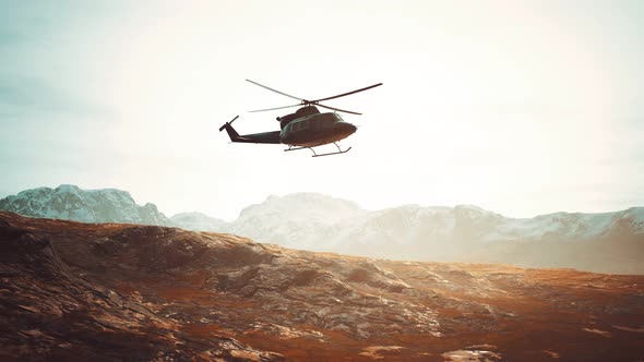 Slow Motion Vietnam War Era Helicopter in Mountains