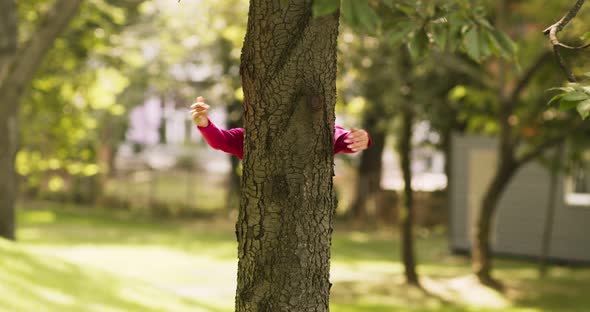 Commitment To Nature. Female Hands Embracing Tree Trunk in Park